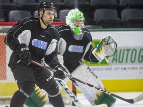 London's newest Knight is defenceman Markus Phillips, looking to tip a shot in front of St. Thomas Stars' Jr. B goalie Matt Onuska during his first practice at Budweiser Gardens. Phillips, who won the Memorial Cup last year with Guelph, was acquired for three draft picks. (Mike Hensen/The London Free Press)