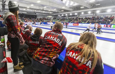 Team Canada players cheer on their teams on the ice in the Friday morning matchs of the Continental Cup at the Western Fair Sports Centre in London, Ont. Europe won 7-5 after starting out with a 4-0 lead early in the match. Photograph taken on Friday January 10, 2020.  Mike Hensen/The London Free Press/Postmedia Network