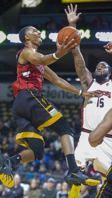 Mareik Isom of the London Lightning drives in on Sam Muldrow of the Windsor Express in their NBL game Saturday night at Budweiser Gardens in London. Photograph taken on Saturday January 11, 2020. Mike Hensen/The London Free Press/Postmedia Network