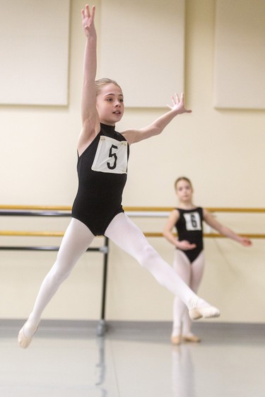 Isabelle Hiltz, 10, leaps as part of her audition for Canada's National Ballet School at Dance Steps on Colborne Street in London on Sunday. The school teaches students in Toronto from Grades 6-12 with Grade 5 students able to attend summer school. Mike Hensen/The London Free Press/Postmedia Network