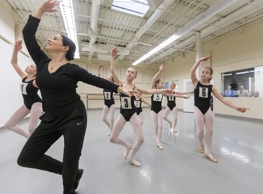 Young dancers from Grades 5, 6 and 7 follow the lead of National Ballet School teacher Katie Park at Dance Steps on Colborne Street in London on Sunday. The school teaches students in Toronto from Grades 6-12 with Grade 5 students able to attend summer school.
Mike Hensen/The London Free Press/Postmedia Network
