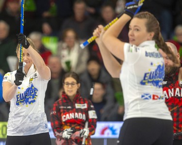 Europe's Sara McManus and Agnes Knochenhauer salute the shot of skip Niklas Edin during their skins match Sunday afternoon against Canada's BJ Neufeld on the final day of the Continental Cup being played Sunday at the Western Fair Sports Centre in London, Ont. 
Photograph taken on Sunday January 12, 2020. 
Mike Hensen/The London Free Press/Postmedia Network