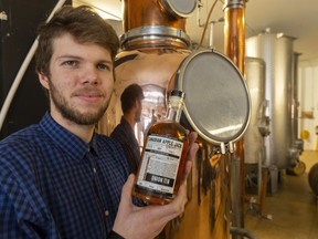 London's Union Ten Distilling has only been open since May, making the Canadian Apple Jack distiller Spencer Bradburn is holding and other spirits, but the London liquor maker, bar, music venue and event site is already planning an expansion. (Mike Hensen/The London Free Press)