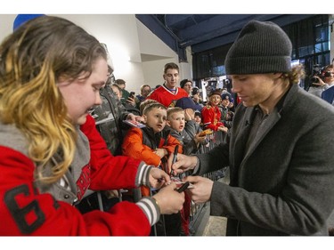 Patrick Kane signs an autograph for Caitlin Jennings before having his No. 88 for the London Knights retired at Budweiser Gardens Friday. (Mike Hensen/The London Free Press)