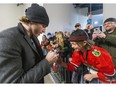 Patrick Kane signs autographs before having his No. 88 for the London Knights retired at Budweiser Gardens on Friday. (Mike Hensen/The London Free Press)
