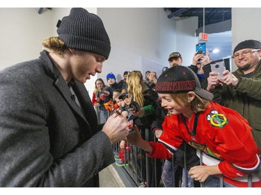 Patrick Kane signs autographs before having his No. 88 for the London Knights retired at Budweiser Gardens on Friday. (Mike Hensen/The London Free Press)