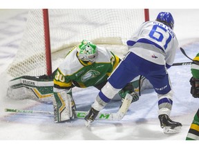 Chase Stillman of Sudbury tries to shove the puck past the outstretched pad of Knights goaltender Brett Brochu. After a review, it was no goal as the London Knights took on the Sudbury Wolves Friday at Budweiser Gardens. (Mike Hensen/The London Free Press)