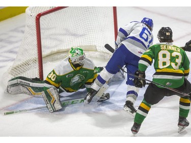 Chase Stillman of Sudbury gets close in on Knights goaltender Brett Brochu, but the ruling was the puck never crossed the line as the London Knights took on the Sudbury Wolves Friday at Budweiser Gardens. (Mike Hensen/The London Free Press)