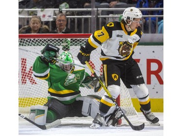 Brett Brochu of the Knights gets knocked into the net by Jake Gravelle of the Bulldogs as the London Knights host the Hamilton Bulldogs at Budweiser Gardens on Friday Jan. 24, 2020.  (Mike Hensen/The London Free Press)