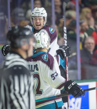 Connor McMichael of the London Knights jumps on Liam Foudy after Foudy's first-minute tally against the Guelph Storm Sunday afternoon at Budweiser Gardens in London. 
Photograph taken on Sunday January 26, 2020. Mike Hensen/The London Free Press/Postmedia Network