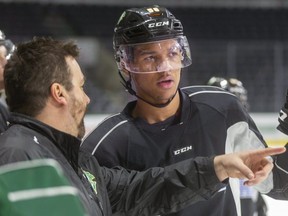 Knights assistant coach Dylan Hunter talks to Bryce Montgomery during practice at Budweiser Gardens in London. (File photo)