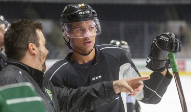 Knights assistant coach Dylan Hunter talks to Bryce Montgomery during practice at Budweiser Gardens in London. (Mike Hensen/The London Free Press)