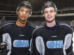 Knights defensemen Bryce Montgomery and Benjamin Roger pause during practice at Budweiser Gardens in London. (Mike Hensen/The London Free Press)