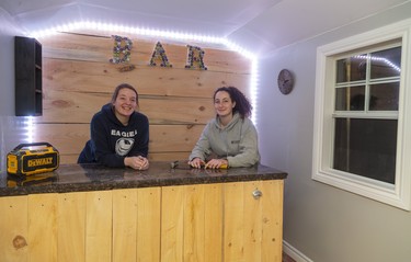 Brittany Wilson and Brooke Loyens of Fanshawe's construction technology course were busy decorating the a shed that is being raffled off for Habitat for Humanity during the Lifestyle Home show this weekend at the Western Fair's Agriplex in London, Ont.  Photograph taken on Thursday January 30, 2020.  Mike Hensen/The London Free Press/Postmedia Network ORG XMIT: POS2001301920327046