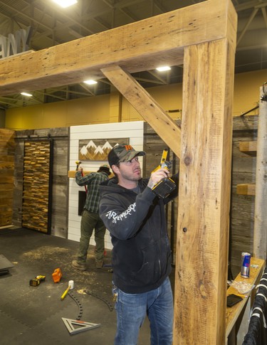 Shawn McLean, the owner of Barn Board Company works on their display at the Lifestyle Home show this weekend at the Western Fair's Agriplex in London, Ont.  Photograph taken on Thursday January 30, 2020.  Mike Hensen/The London Free Press/Postmedia Network ORG XMIT: POS2001301920347048