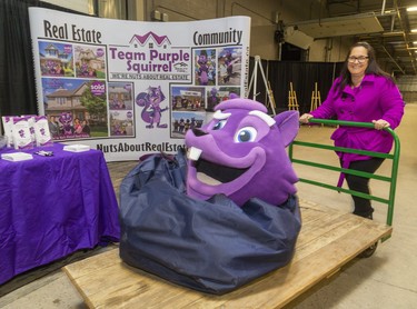 Realtor Daniela Albert of Team Purple Squirrel wheels their mascot into the Lifestyle Home show this weekend at the Western Fair's Agriplex in London, Ont.  Photograph taken on Thursday January 30, 2020.  Mike Hensen/The London Free Press/Postmedia Network