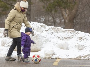 Last day of January is a perfect day for some soccer in the Storybook Gardens parking lot, as Mariane Hossfeld plays with her granddaughter Lucia Salazar-Hossfeld, 2 with her soccer ball.  (Mike Hensen/The London Free Press)