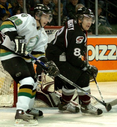 Patrick Kane of the London Knights waits for the puck in front of the Guelph net as he jostles with London native, and fellow future NHLer, Drew Doughty of the Guelph  Storm during a game in London in February 2007. (Sue Reeve/The London Free Press)