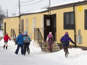 Pupils head for portable classrooms at the end of a recess. (File photo)