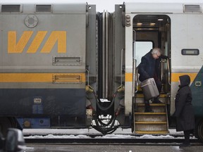 Passengers disembark a VIA Rail train on Jan. 24, 2020.