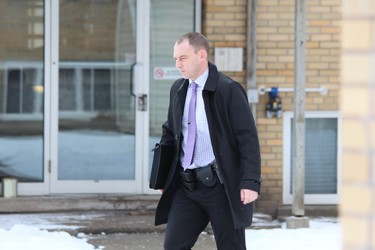 A Brampton police detective arrives at 63 Wellington Rd., where London police assisted their Brantford counterparts in arresting homicide suspect Shajjad Hossain Idrish, 22, on Friday. DALE CARRUTHERS / THE LONDON FREE PRESS