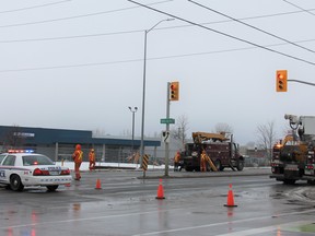 London Hydro crews on Tuesday morning were in the area of Exeter and White Oaks roads, where a downed pole is believed to have caused an outage that left thousands without power. Photo taken Tuesday Feb. 18, 2020. JONATHAN JUHA/THE LONDON FREE PRESS