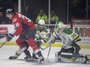 Windsor's Curtis Douglas steals the puck on a London power play but is unable to take advantage against London's Ryan Merkley and goaltender, Brett Brochu, in the first period of OHL action between the Windsor Spitfires and the London Knights at the WFCU Centre, Thursday, February 20, 2020.  (DAX MELMER/Windsor Star)