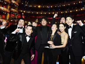 In this handout photo provided by A.M.P.A.S., Best Picture Award winners for "Parasite" pose onstage during the 92nd Annual Academy Awards at the Dolby Theatre on February 09, 2020 in Hollywood, California. (Photo by Matt Petit - Handout/A.M.P.A.S. via Getty Images)