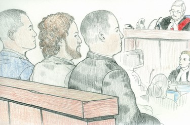 Charged with assault causing bodily harm in the takedown of the wrong suspect, following a violent jewelry store heist, St. Thomas police officers (left to right) Sean James, Daniel Spicer and Frank Boyes, sit in the prisoner's box Wednesday, May 24, at their trial before Ontario Court Justice Ronald Minard in London. (Charles Vincent/Special to The London Free Press/Postmedia News)
