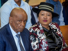 Prime Minister of Lesotho Tom Thabane (L) and his wife Maesaiah Thabane sit at the Magistrate Court in Maseru, Lesotho, on February 24, 2020. - Lesotho Prime Minister Thomas Thabane on February 25, 2020, lauded himself for "voluntarily" agreeing to resign after he was accused of having a hand in the 2017 murder of his estranged wife. The premier has bowed to pressure to step down and announced July 31 as his official resignation date, citing advanced age. (Photo by MOLISE MOLISE / AFP)