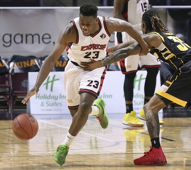 Kemy Osse, left, of the Windsor Express drives pass AJ Gaines of the London Lightning during their game on Wednesday, February 26, 2020 at the WFCU Centre in Windsor, ON. (DAN JANISSE/The Windsor Star)