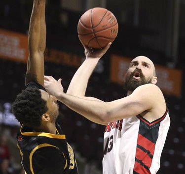 Marcus Capers, left, of the London Lightning pressures Mike Allison of the Windsor Express during their game on Wednesday, February 26, 2020 at the WFCU Centre in Windsor, ON. (DAN JANISSE/The Windsor Star)