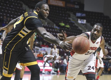 Randy Phillips, left, of the London Lightning and Chris Commons of the Windsor Express battle for the ball during their game on Wednesday, February 26, 2020 at the WFCU Centre in Windsor, ON. (DAN JANISSE/The Windsor Star)