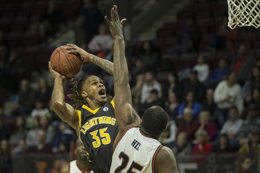 London's AJ Gaines takes a shot in the key against Windsor's Derrick Nix in National Basketball League of Canada action between the Windsor Express and the London Lightning at the WFCU Centre, Friday, February 21, 2020.  (DAX MELMER/Windsor Star)