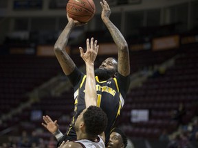 London's Terry Thomas takes a shot over Windsor's Ryan Anderson in NBL Canada action between the Windsor Express and the London Lightning at the WFCU Centre, Sunday, February 2, 2020.  (DAX MELMER/Postmedia Network)