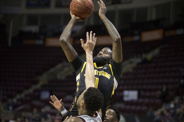 London's Terry Thomas takes a shot over Windsor's Ryan Anderson in NBL Canada action between the Windsor Express and the London Lightning at the WFCU Centre, Sunday, February 2, 2020.  (DAX MELMER/Postmedia Network)