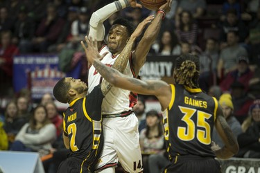 Windsor's Alex Johnson tries to get past London's Xavier Moon and AJ Gaines in National Basketball League of Canada action between the Windsor Express and the London Lightning at the WFCU Centre, Friday, February 21, 2020.  (DAX MELMER/Windsor Star)