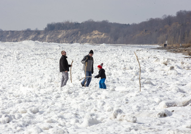 Three generations of Foley men, Bruce (middle) of St. Thomas, Paul (left) and Liam (5) explore the shore ice on the beach in Port Stanley. on Sunday February 16, 2020. Paul and Liam were visiting from Strathroy. Derek Ruttan/The London Free Press/Postmedia Network