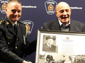 London police Chief Steve Williams hailed the late Lewis (Bud) Coray, the city's first Black police officer, as a "trailblazer" and "positive role model" Monday. Coray, who died last Thursday at 97, is seen here with Williams at a 2020 ceremony. (Files)