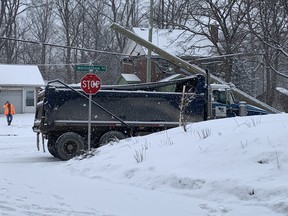 A hydro pole was toppled by a snowplow along Wellington Road Thursday morning, snarling traffic in both directions along the busy road just south of downtown. (Jonathan Juha/The London Free Press)