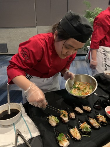 Fanshawe College culinary arts student Han Dao skillfully prepares steamed sea bass canapes at the 2020 Dragon Gala reception Saturday Feb. 8. About 570 guests flocked to RBC Place for the Chinese New Year celebration. (Jennifer Bieman/The London Free Press)