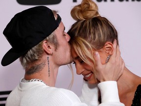 Justin Bieber and his wife Hailey Baldwin pose at the premiere for the documentary television series "Justin Bieber: Seasons" in Los Angeles, Jan. 27, 2020.