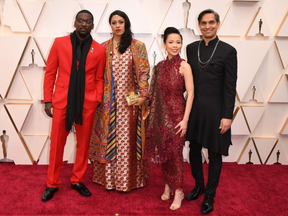 Sami Khan, right, co-director of the Oscar nominated short documentary St. Louis Superman, and co-director Smriti Mundhra, second from left, producer Poh Si-Teng and Bruce Franks Jr. arrive for the 92nd Oscars at the Dolby Theatre in Hollywood, California Sunday. ROBYN BECK / AFP VIA GETTY IMAGES