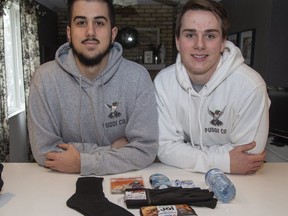 For every five Puddi Co sweatshirts sold, business partners Mikail Tiernay (left) and Aaron Puddicombe give a care package containing clothes, food and personal hygiene products to a homeless person. Photo shot in London, Ont. on Sunday February 2, 2020. (Derek Ruttan/The London Free Press)