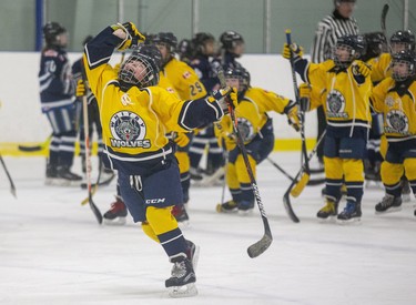 Abigail Knowles and her Whitby Wolves teammates celebrate an overtime goal that gave them a 2-1 victory over the Brampton Canadettes and the Atom BB championship at the 30th Annual London Devilettes Tournament in London on Sunday. (Derek Ruttan/The London Free Press)