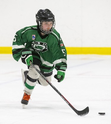 Mikayla Liddell of The Lucan Irish rushes up ice during the peewee B championship game against the Sarnia Lady Sting at the 30th Annual London Devilettes Tournament in London on Sunday. (Derek Ruttan/The London Free Press)