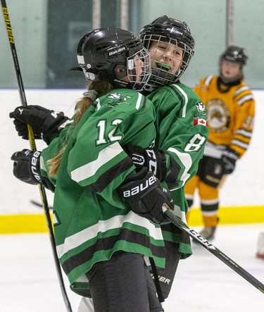 Kaitlyn Martelle of the Lucan Irish (12)  celebrates her goal with Nicole Beattie (8) during the peewee B  championship game against the Sarnia Lady Sting at the 30th Annual London Devilettes Tournament in London on Sunday. (Derek Ruttan/The London Free Press)
