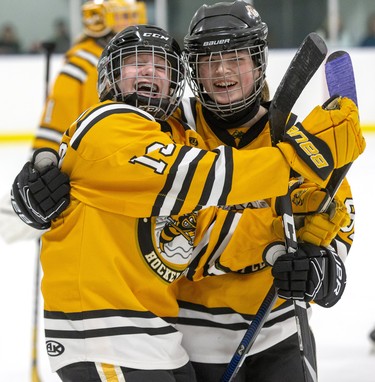 Keeley Richardson (left) and Jada Smith of the Sarnia Lady Sting celebrate after an overtime win against the Lucan Irish in the peewee B championship game at the 30th Annual London Devilettes Tournament in London. on Sunday. (Derek Ruttan/The London Free Press)