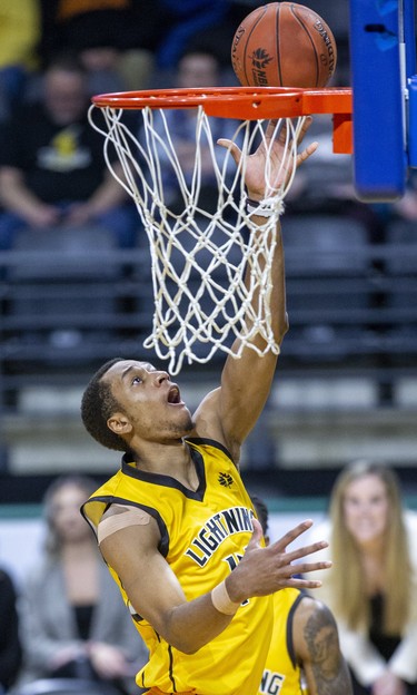 Mareik Isom of the London Lightning lays up a basket against the Kitchener-Waterloo Titans during their National Basketball League of Canada game at Budweiser Gardens in London on Thursday. (Derek Ruttan/The London Free Press)