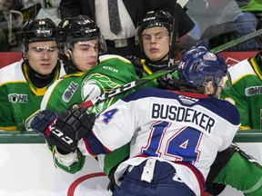 DJ Busdeker of the Saginaw Spirit squishes Luke Evangelista of the London Knights in London on Feb. 7, 2020. (Derek Ruttan/The London Free Press)